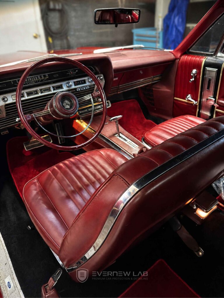 Professional interior deep clean on a classic 1967 Ford Galaxie XL with burgundy leather upholstery in Sydney.