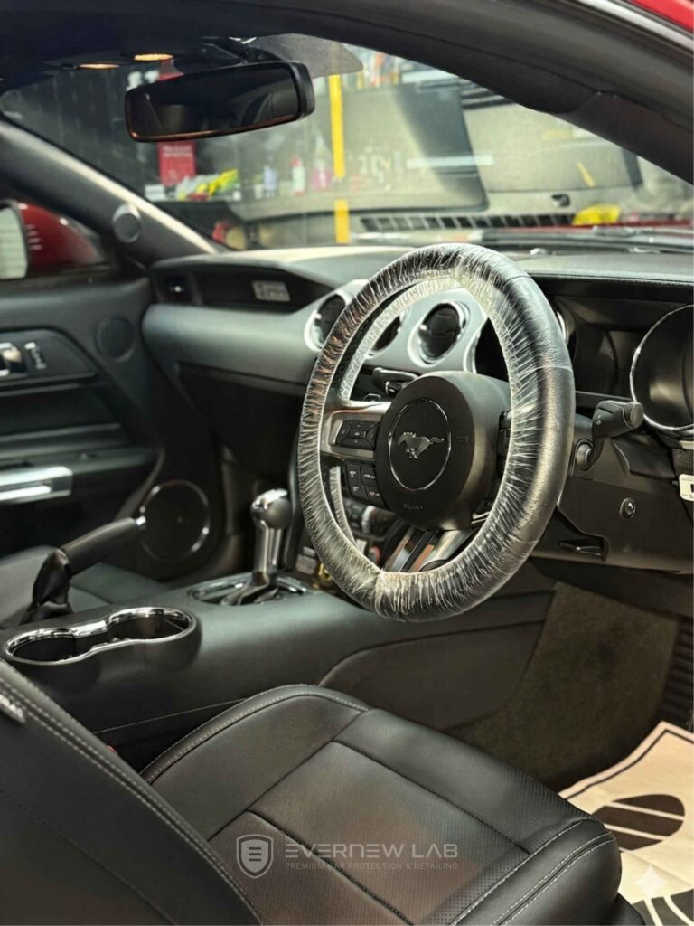 Interior of a 2025 Ford Mustang with Gtechniq ceramic coating on leather seats, fabric and plastic trim in Sydney.