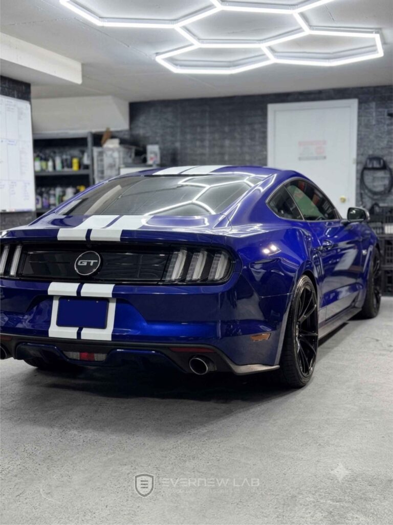 Blue Ford Mustang GT with white stripes after professional Gtechniq ceramic coating and paint correction for a car show in Sydney.