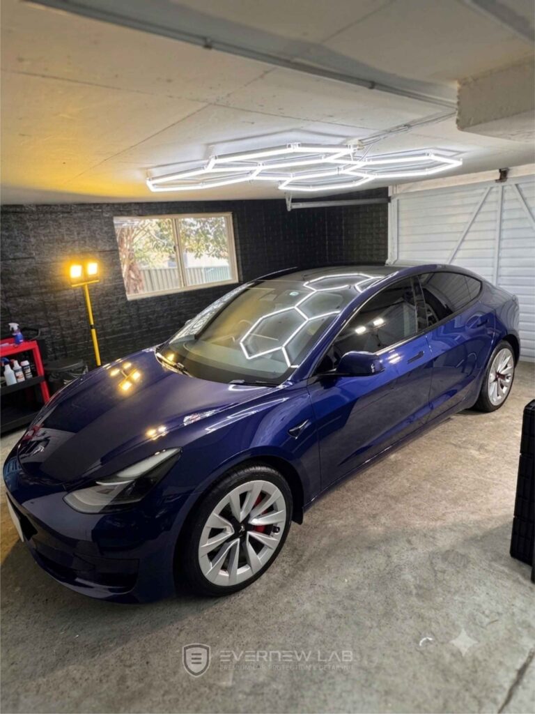 Tesla Model 3 with a mirror-like finish after premium EV detailing and ceramic paint protection in Sydney.