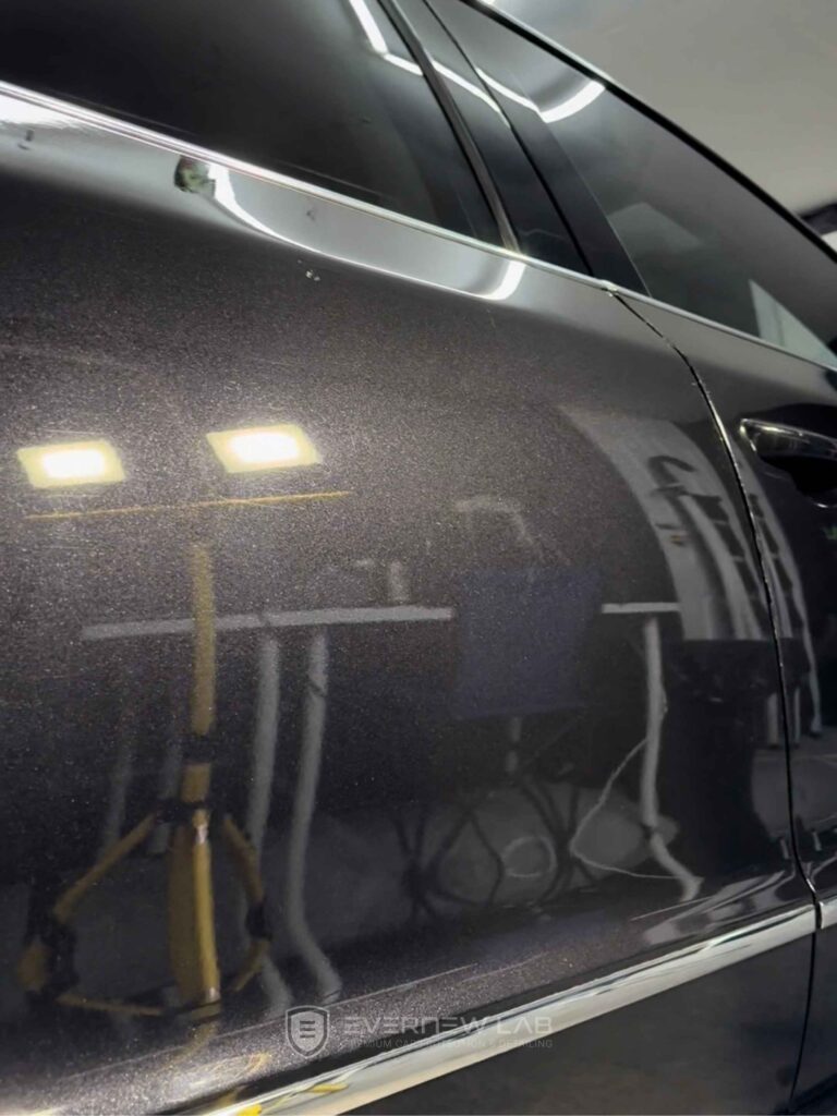 Mercedes-Benz door panel showing deep reflections and no swirl marks after full paint correction and detailing in Sydney.