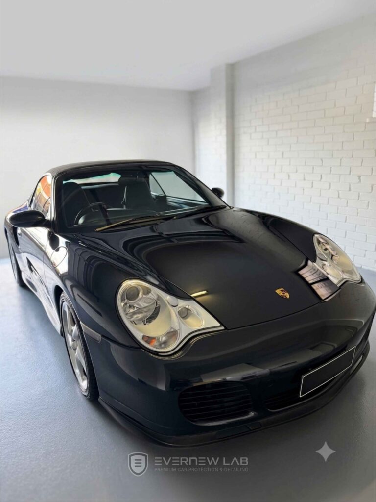 Black Porsche 911 Carrera convertible after a professional full car detailing and paint correction service in Sydney.