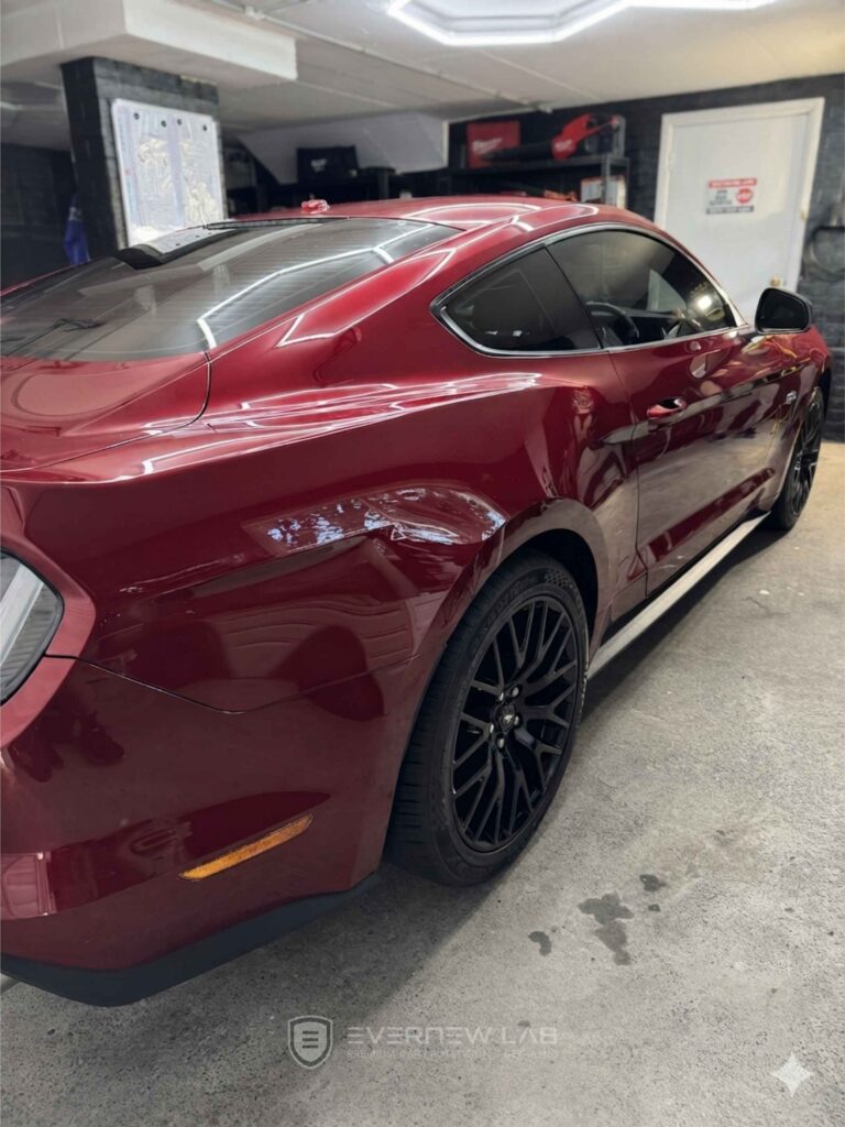 Deep red Ford Mustang with glossy paintwork after professional ceramic coating and car detailing in Sydney.